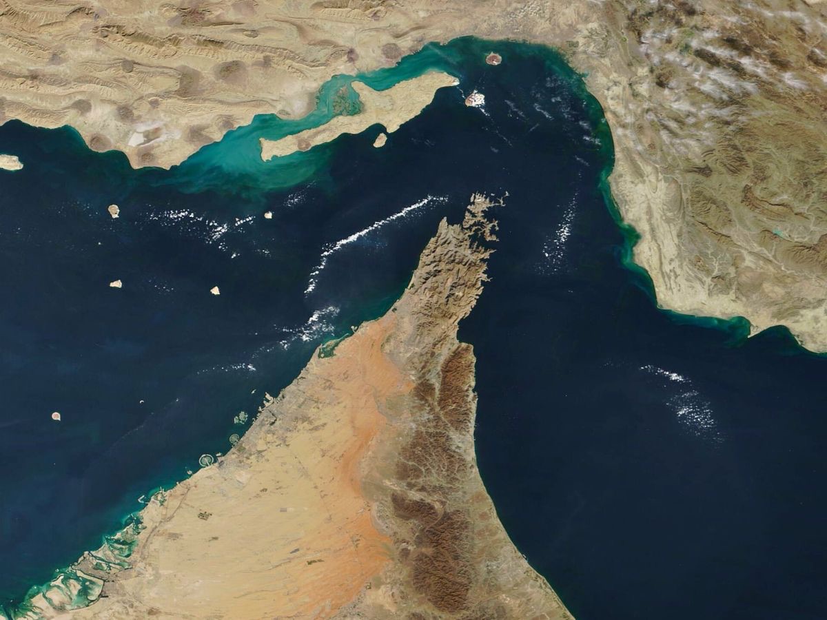 Satellite view of the Strait of Hormuz, the narrow sea channel between the Arabian Peninsula and Iran linking the Persian Gulf to the open ocean