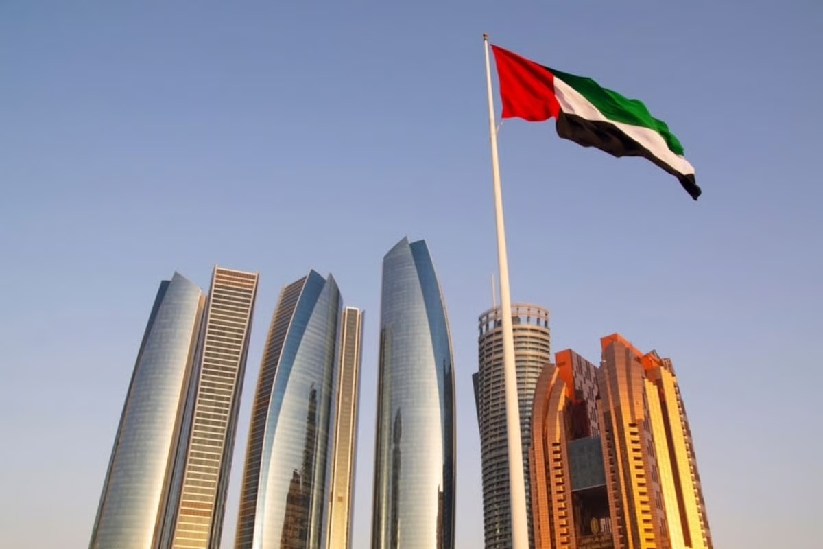 Aerial view of a modern UAE city skyline with towers and waterways, representing a diversified and resilient economy